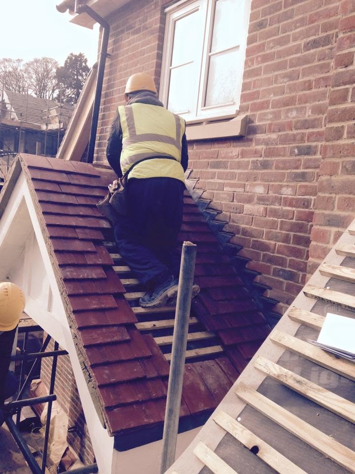 Roof repair work in progress with scaffold in place